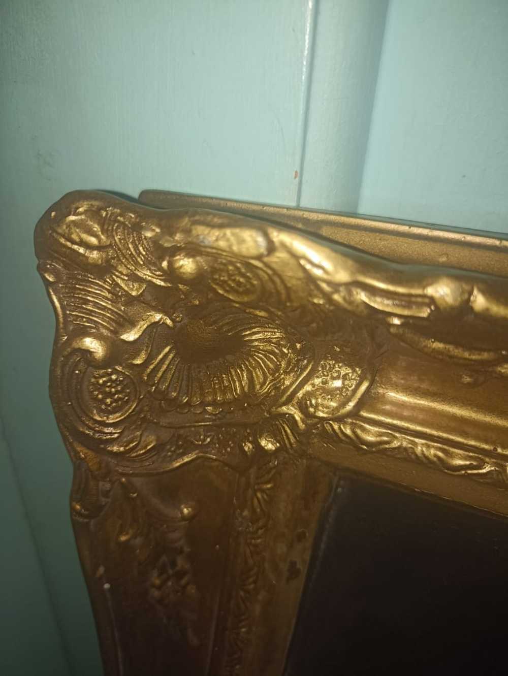 Frames & Mirrors Patterned Gilded Vintage Mirror was listed for 2,000